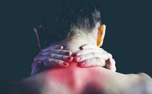 Man Holding His Neck