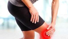 A Person Holding Their Knee in Pain